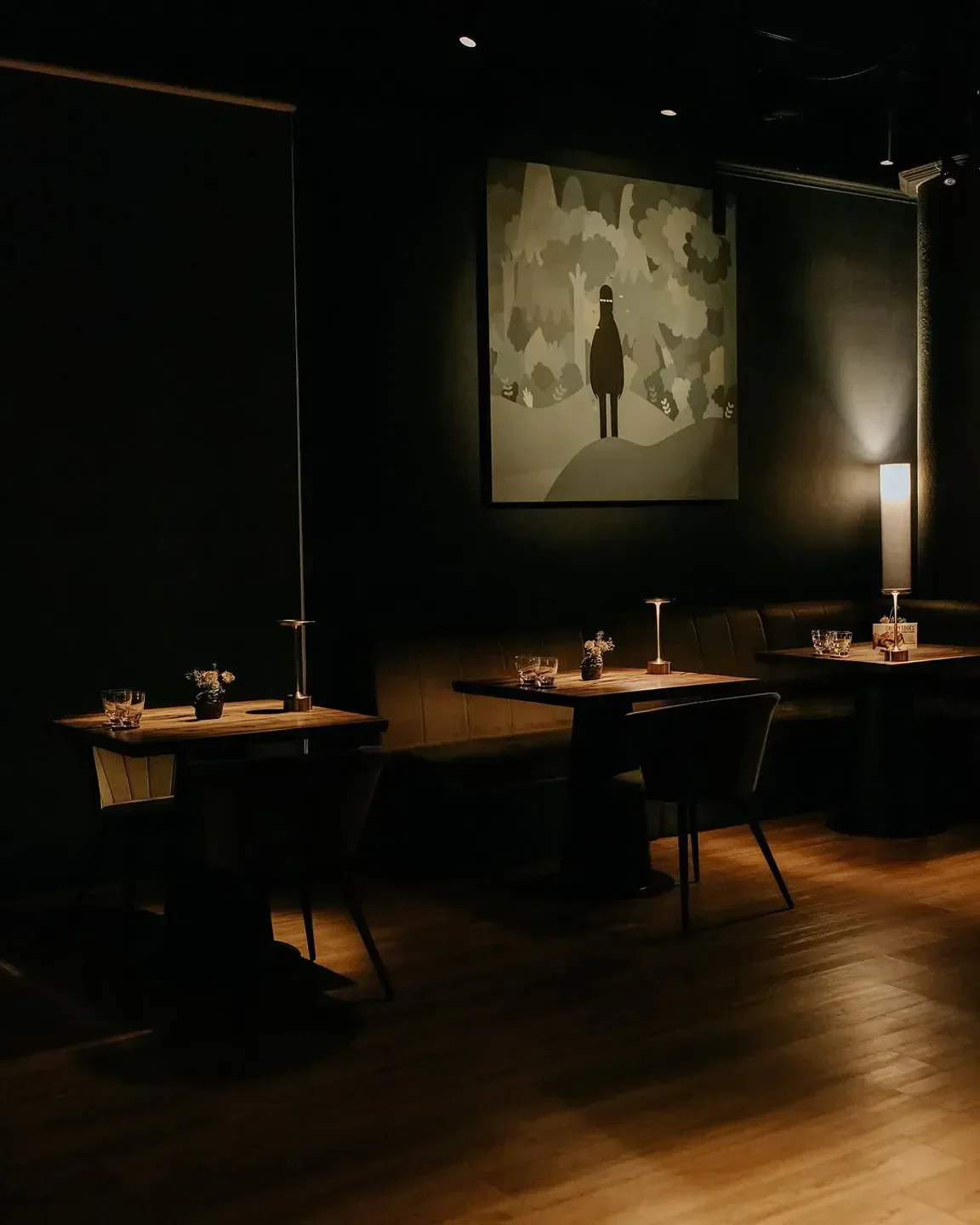 Cozy dining area at Labyrinth restaurant in Singapore, featuring unique art and ambiance.