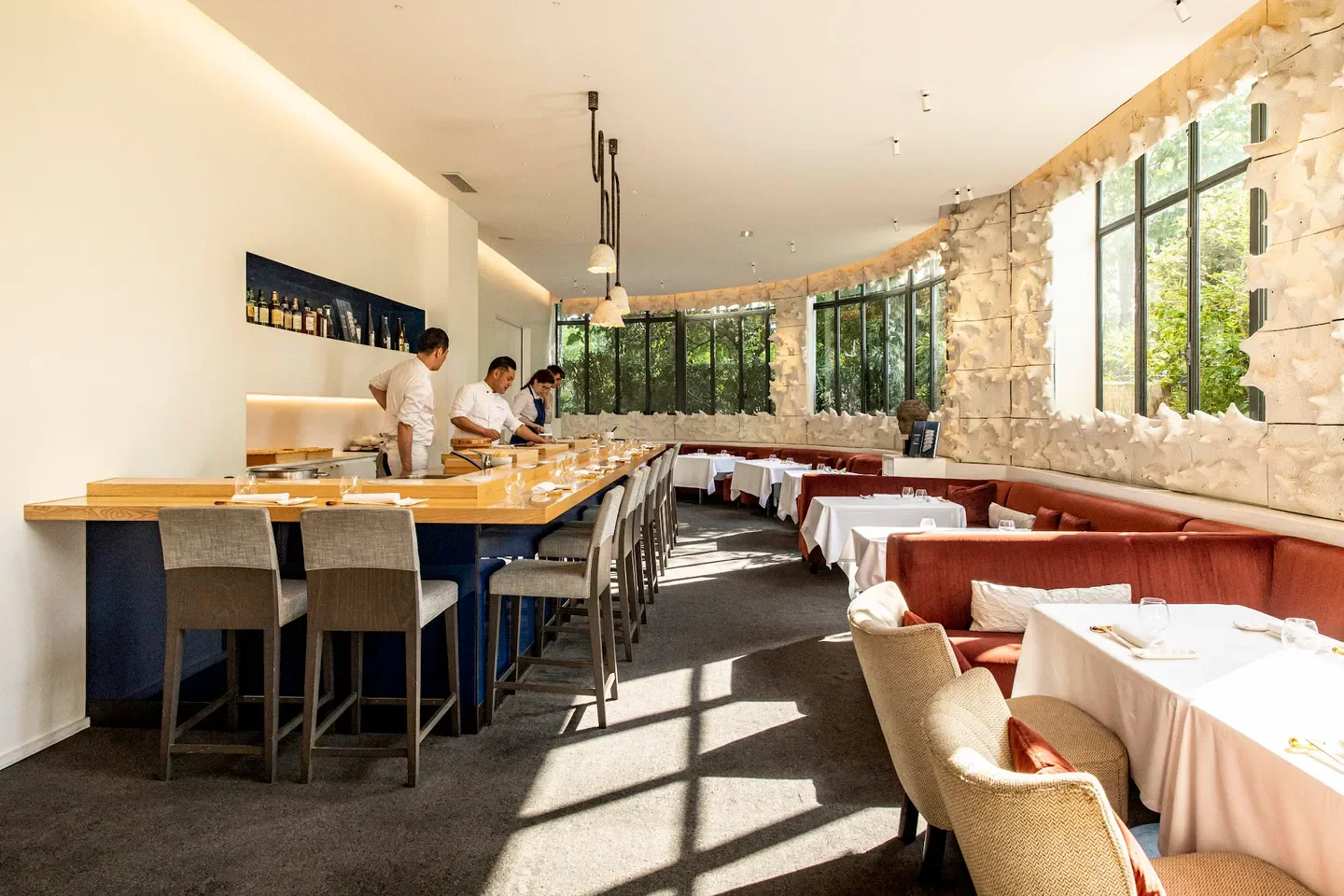 Interior of L'Abysse au Pavillon Ledoyen, a restaurant in Paris with chefs at work