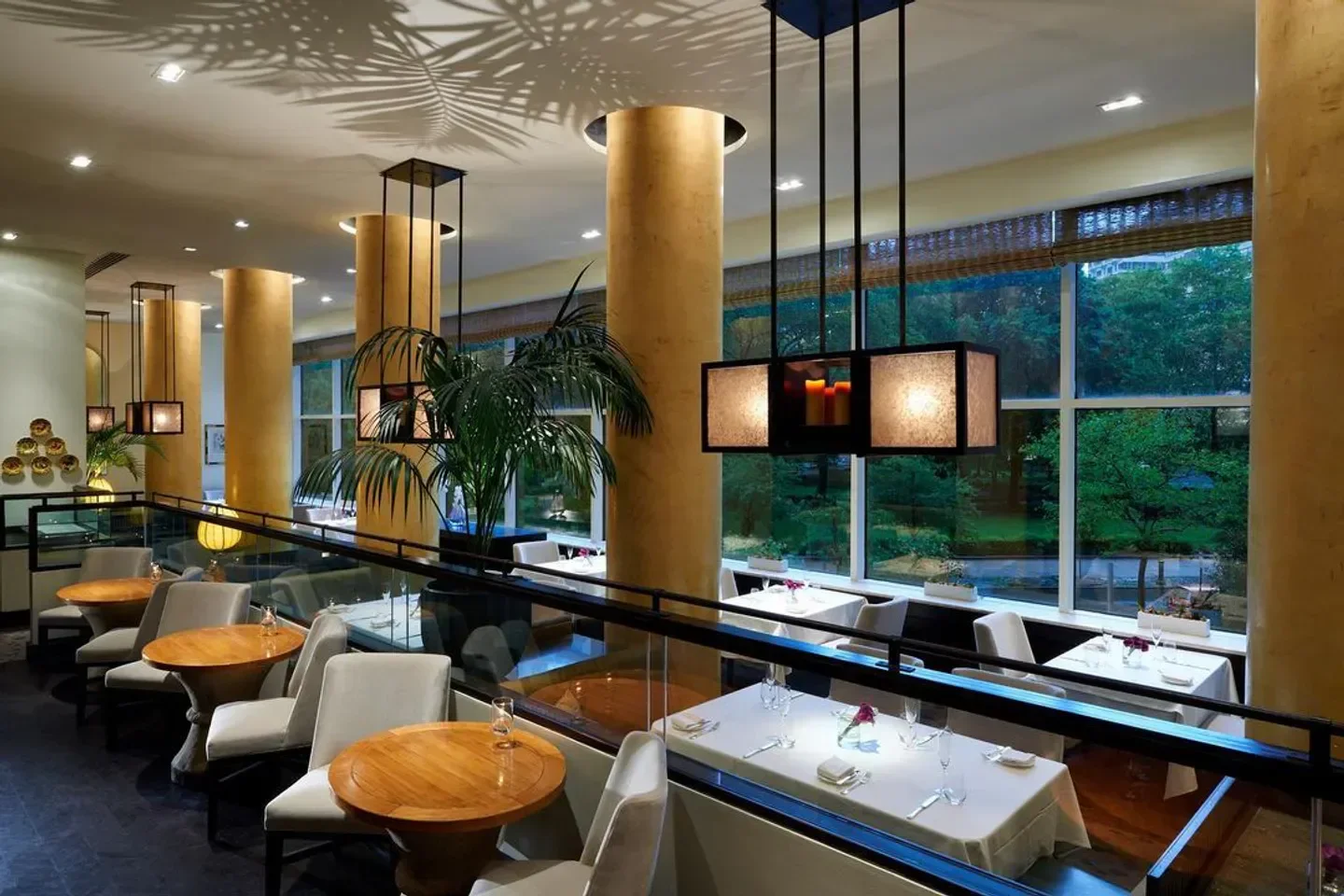 Elegant dining room at Lacroix in Philadelphia with a view, featuring stylish decor.