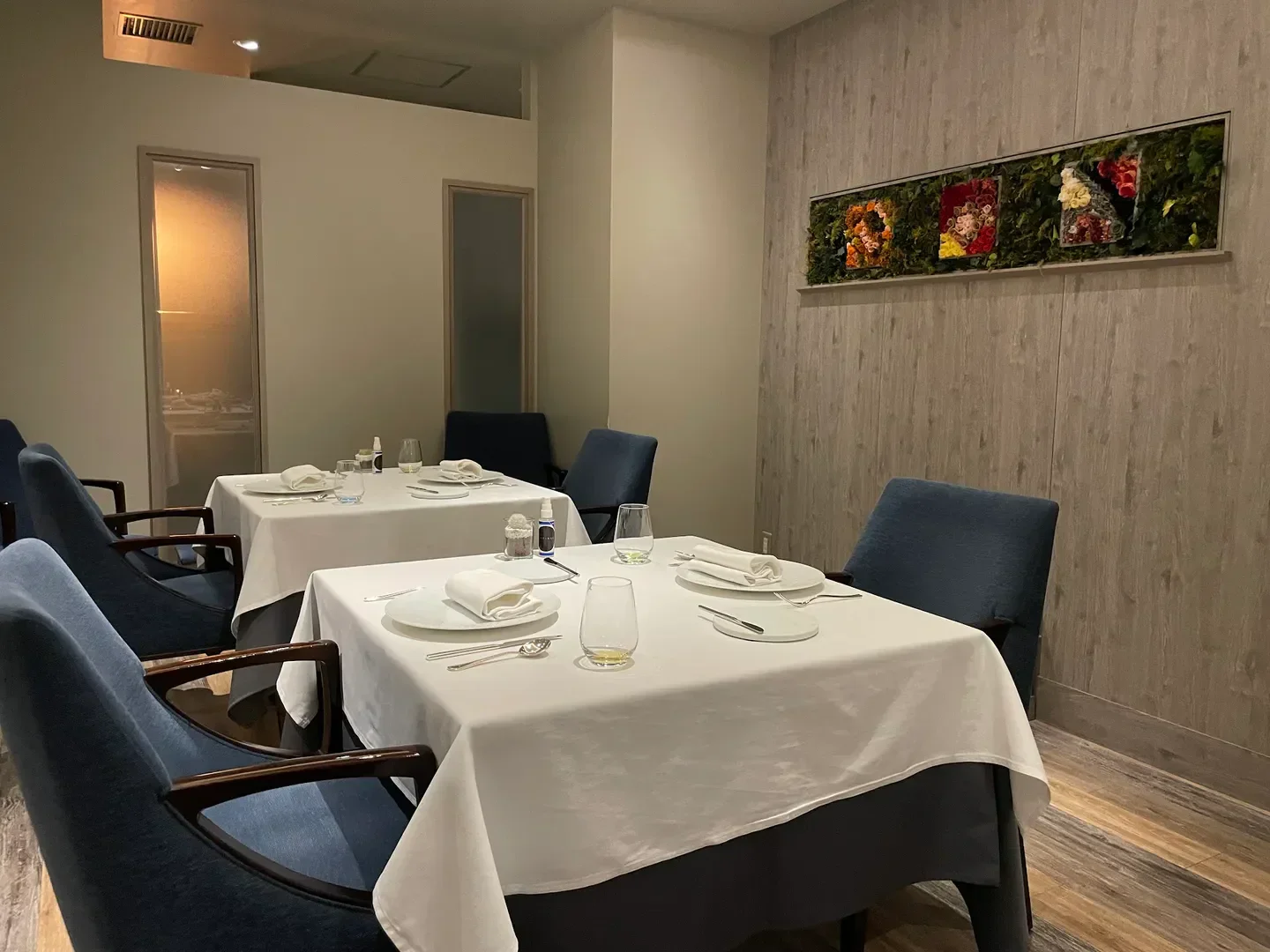 Elegant interior of L'Affinage restaurant in Tokyo, featuring stylish dining tables and decor.
