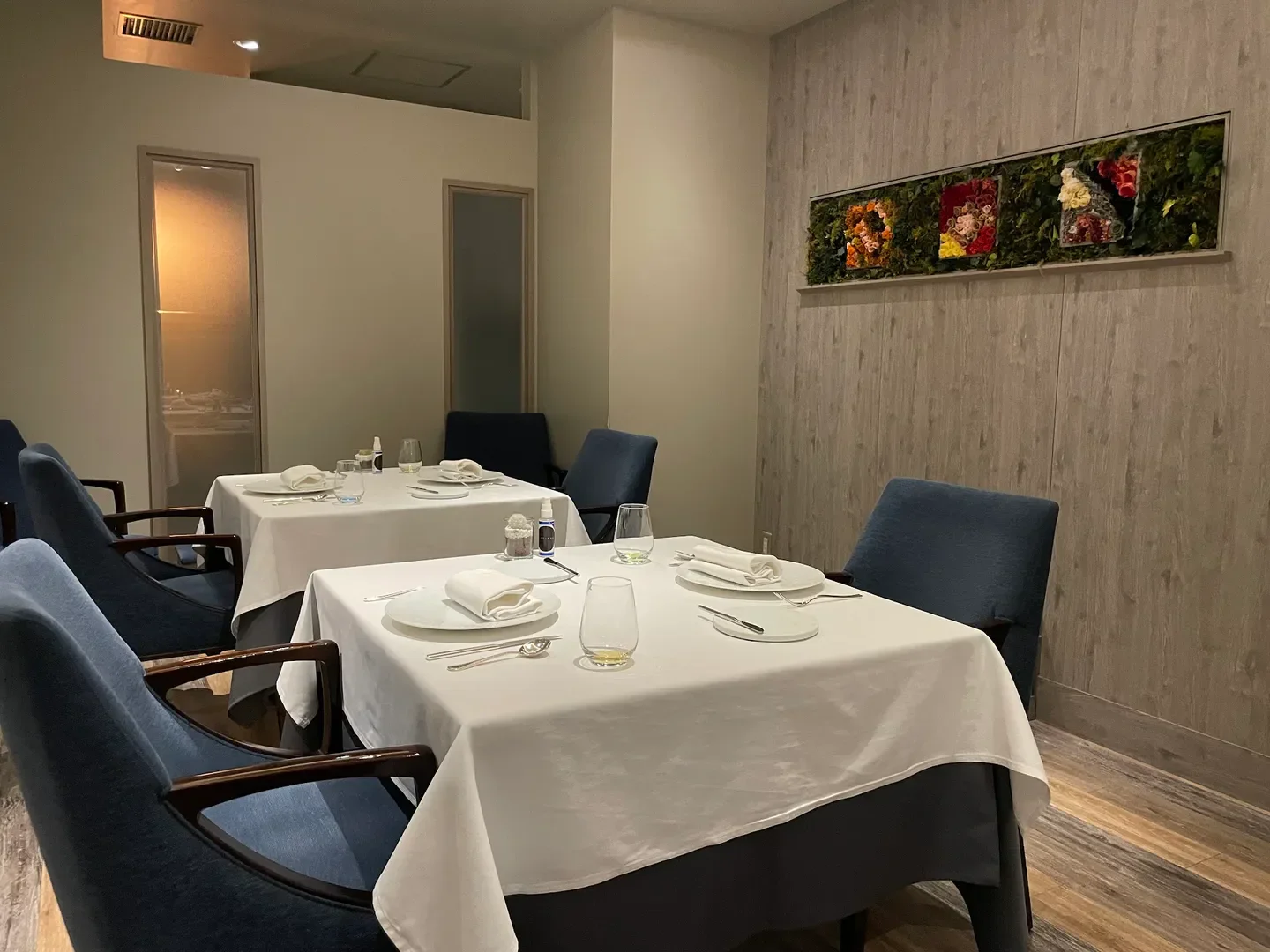Elegant interior of L'Affinage restaurant in Tokyo, featuring stylish dining tables and decor.