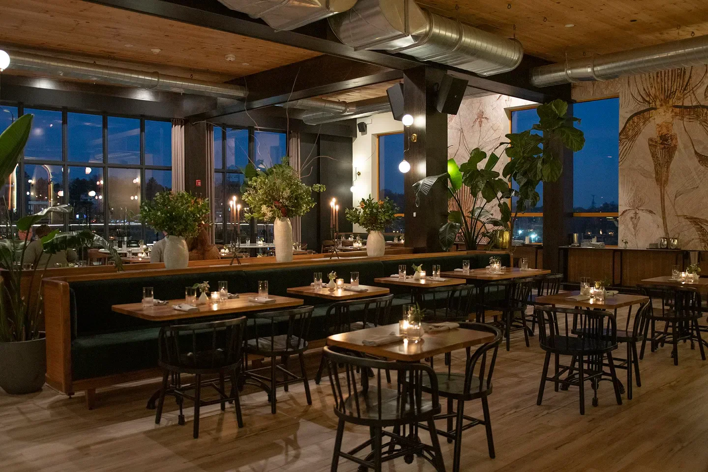 Interior of Lark restaurant in Philadelphia, featuring tables set for dinner service.