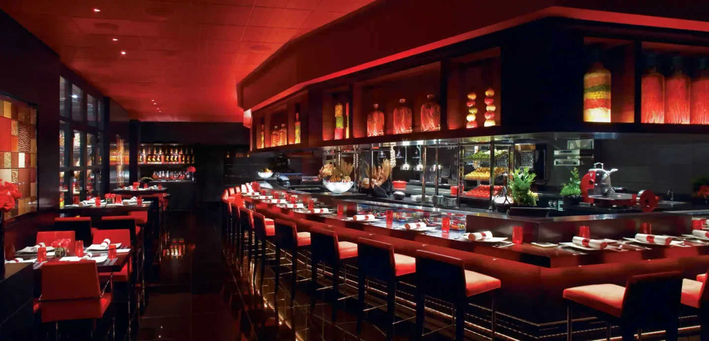 Stylish interior of L'Atelier de Joël Robuchon Las Vegas restaurant, a Las Vegas dining destination.