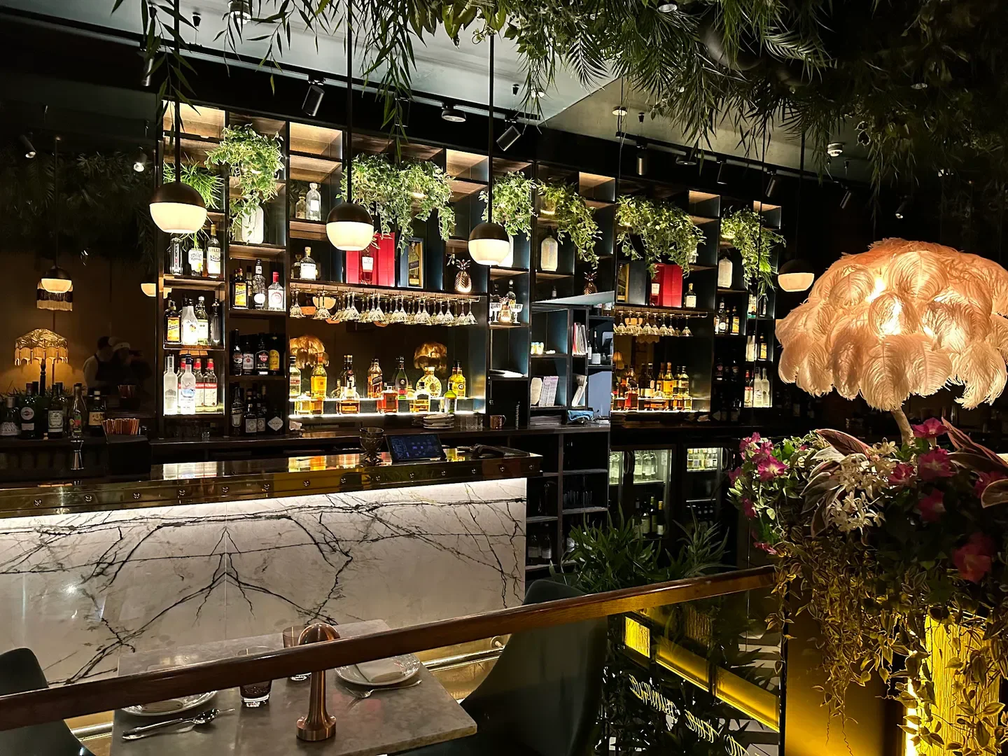 Stylish bar interior at Launceston Place restaurant, London, with elegant decor and lighting.