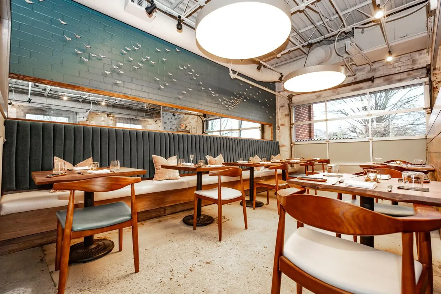 Interior of Lazy Betty restaurant in Atlanta, featuring stylish seating and artistic decor.