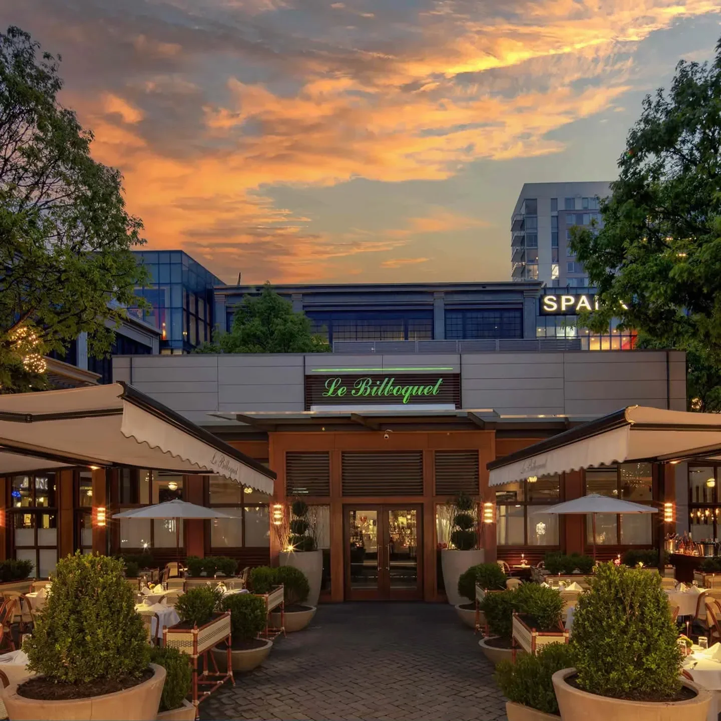 Le Bilboquet restaurant in Atlanta at sunset with outdoor dining area.