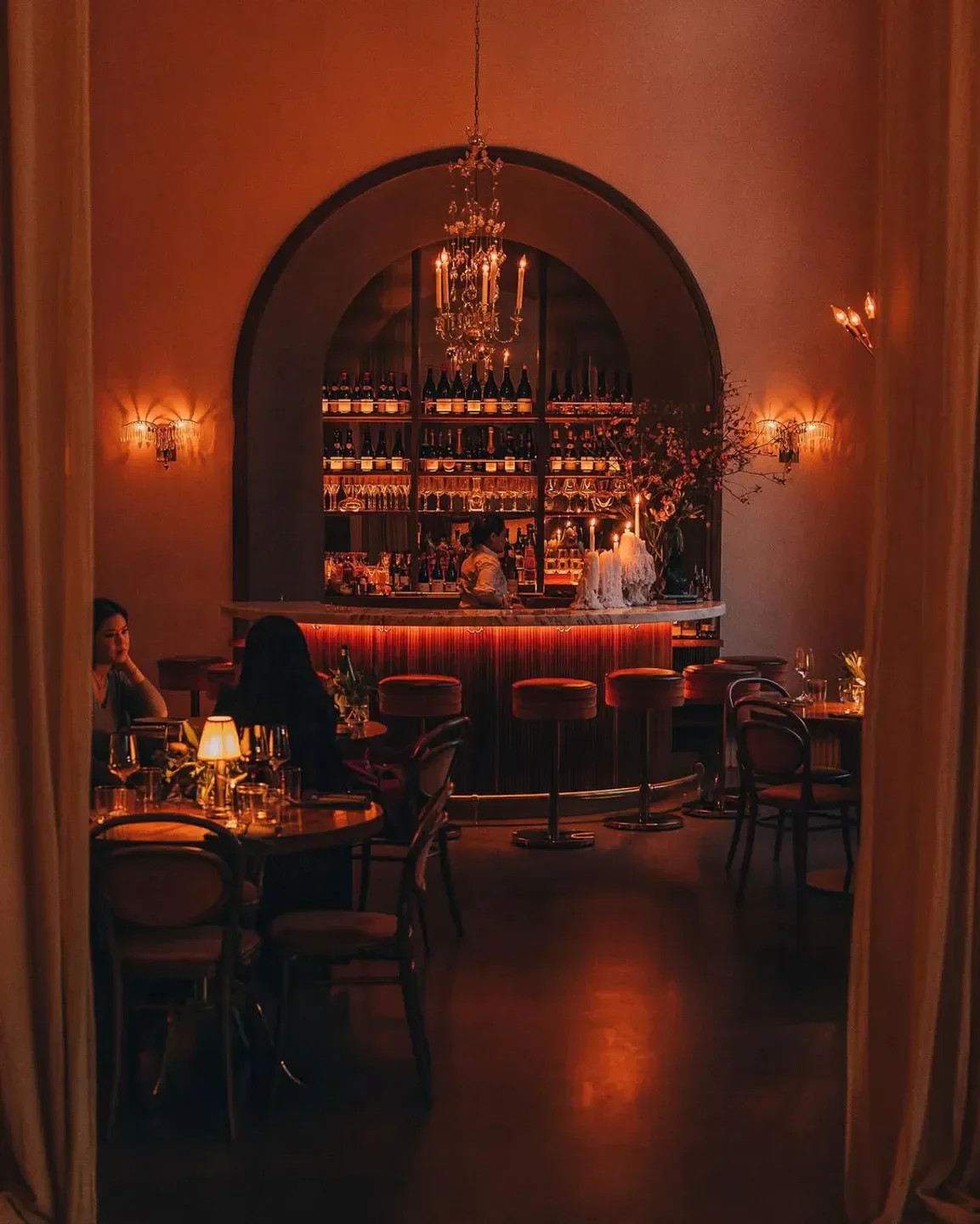 Cozy bar interior at Le Bon Nosh in Atlanta with ambient lighting and intimate setting.