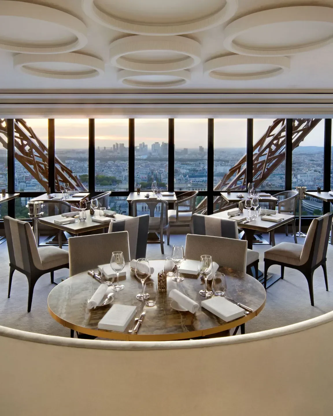 Elegant dining room at Le Jules Verne, Paris, with Eiffel Tower view