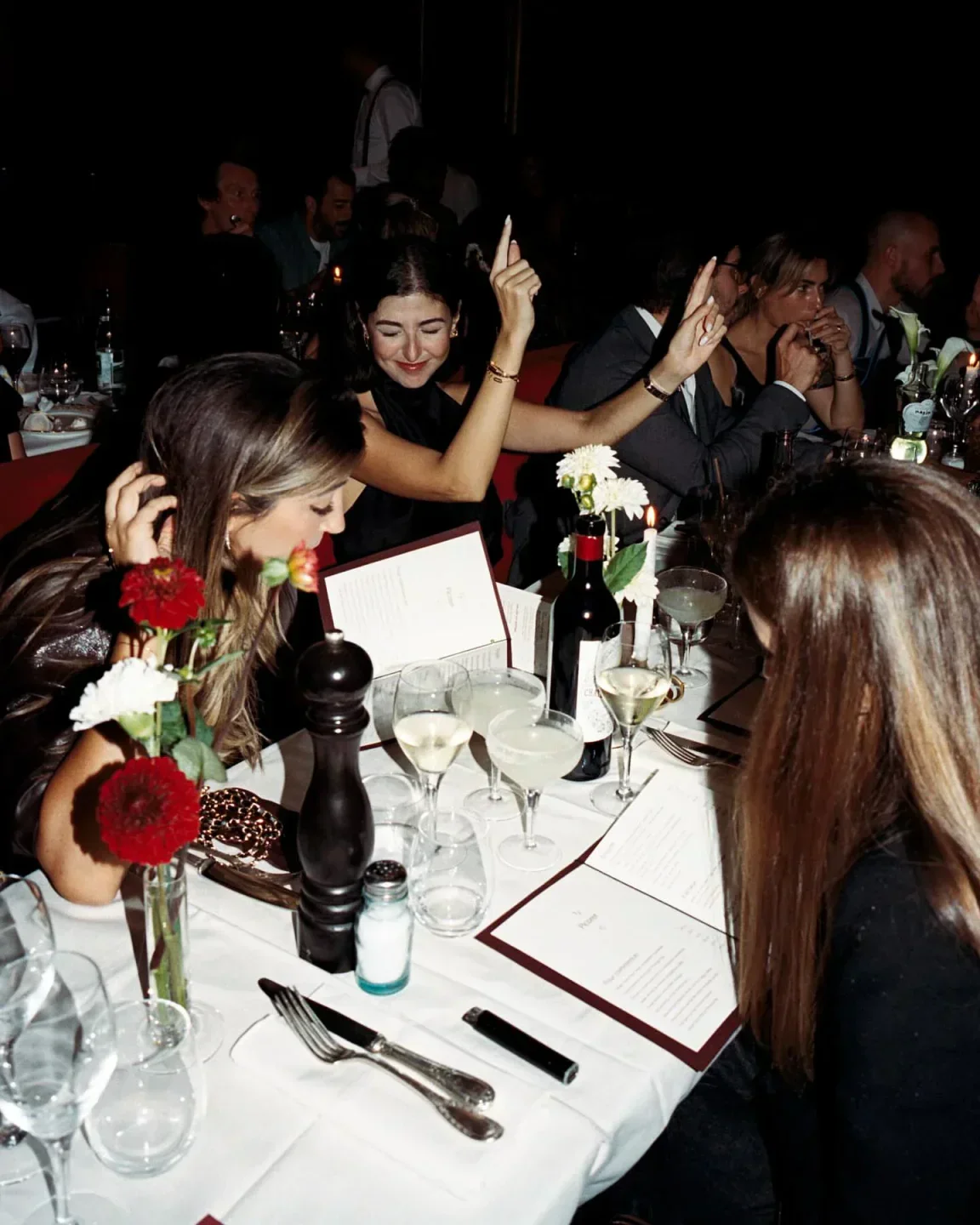 Happy diners at Le Piaf nightclub in Val-d'Isère enjoying a festive evening