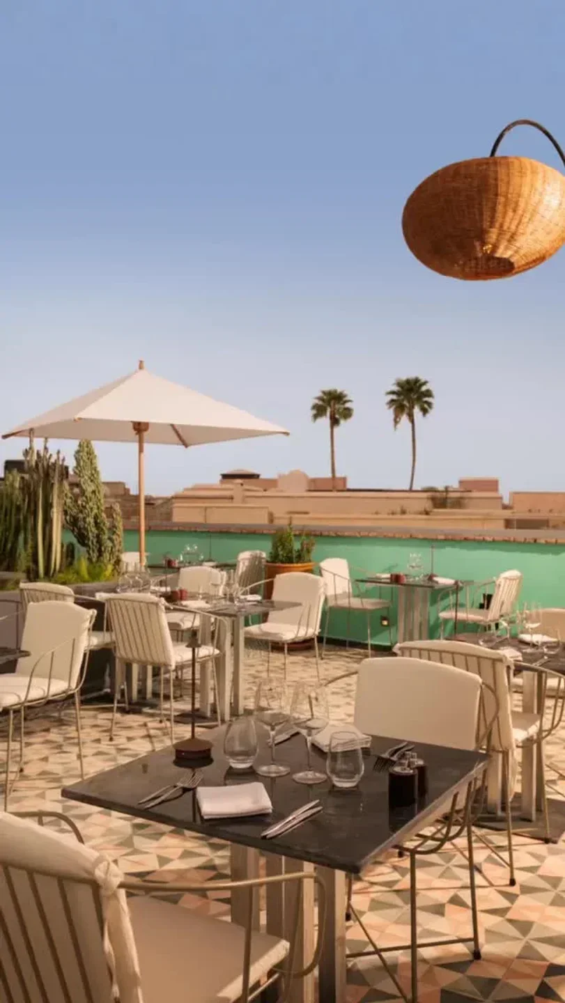 Rooftop terrace at Le Trou au Mur in Marrakech, with tables set for dining