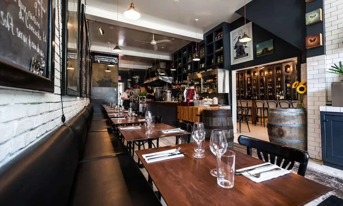 Elegant dining area at Le Vin Papillon in Montreal, with tables set and ready.