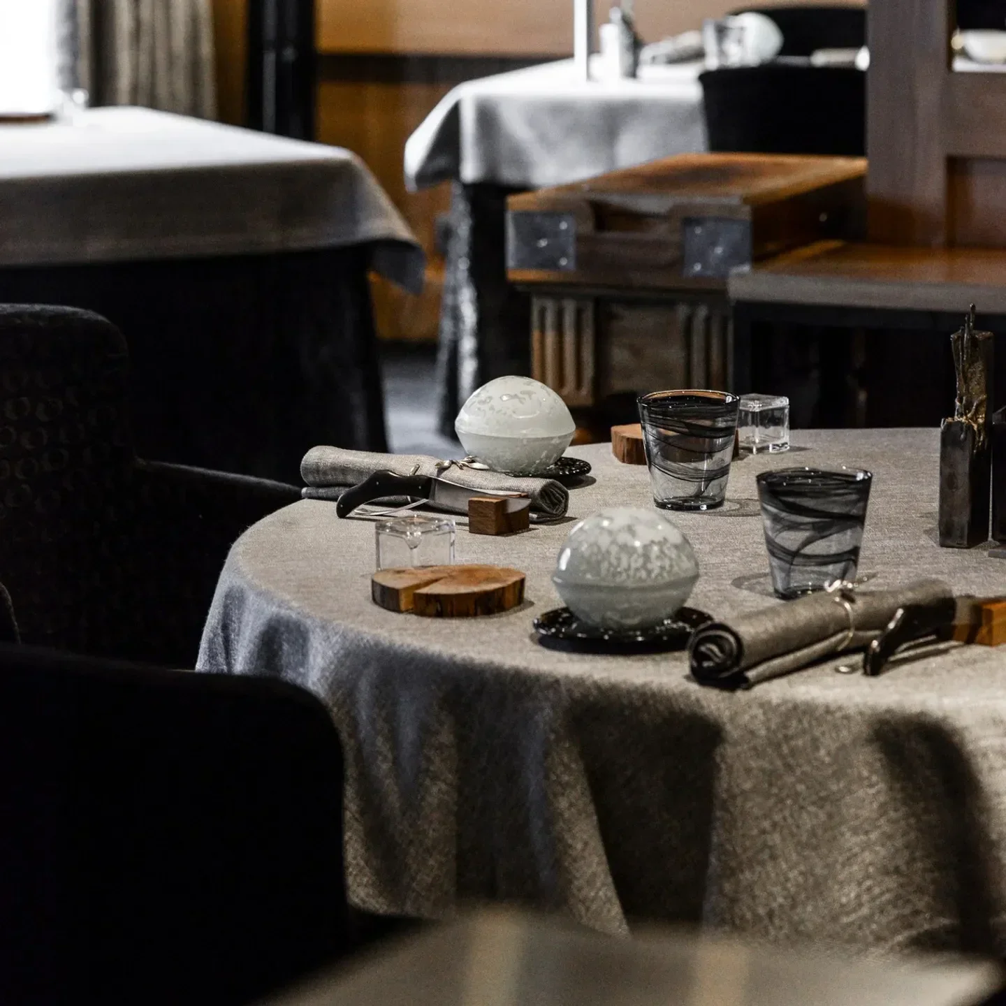 Elegant dining table setting at L'Ekrin restaurant in Meribel, showcasing fine dining details