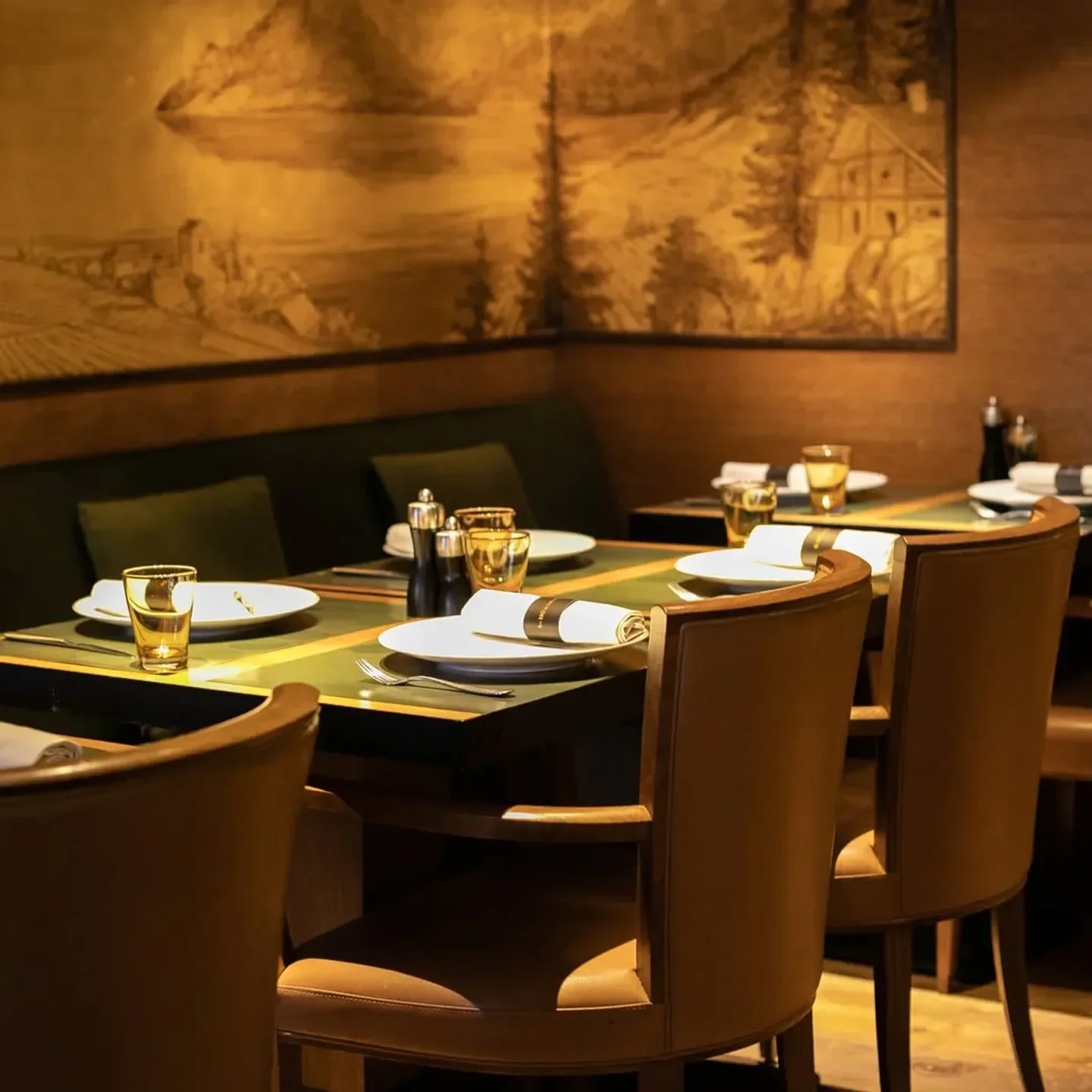 Cozy dining area at Les 110 de Taillevent restaurant in Paris, featuring elegant seating and decor