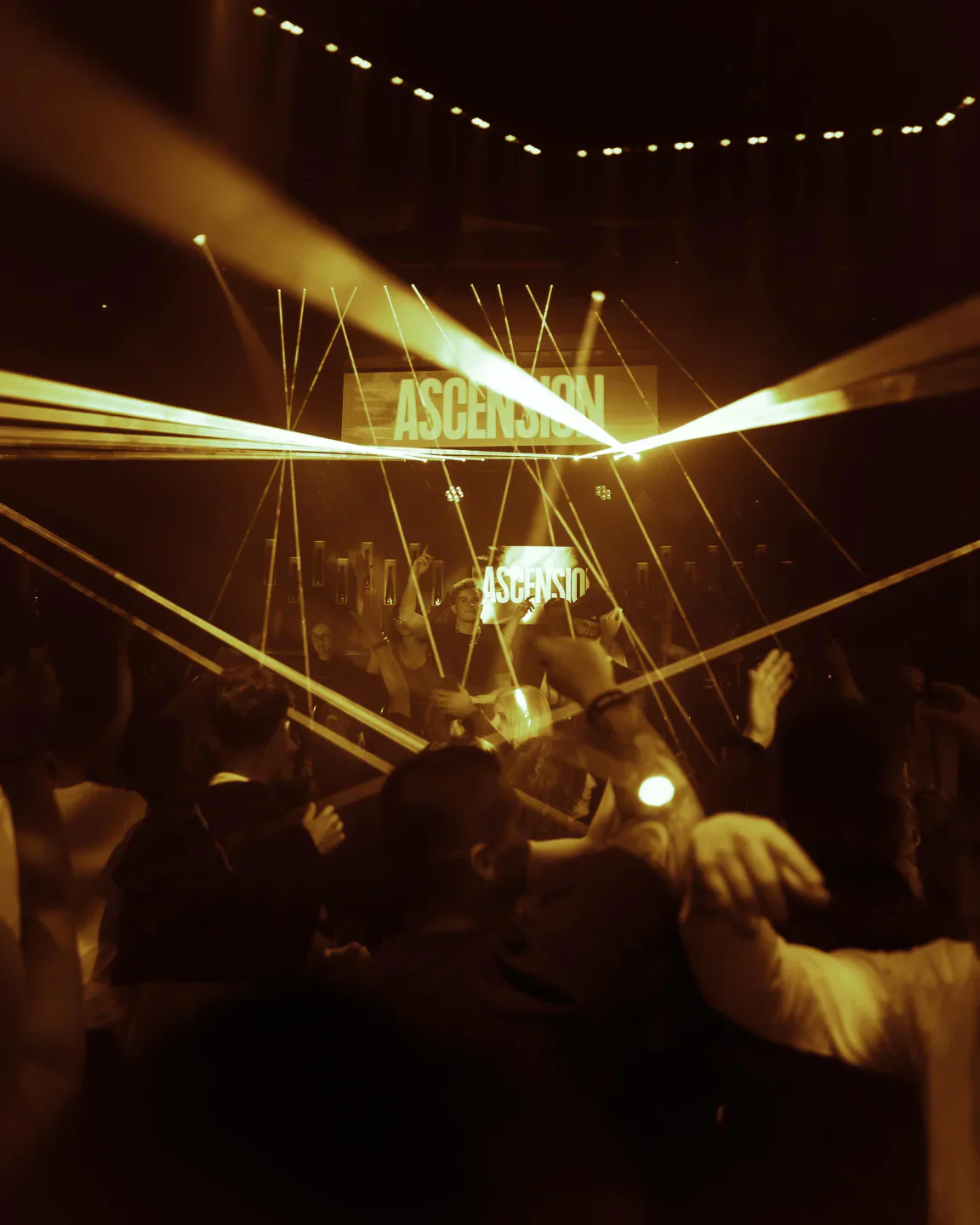 Laser show and "ASCENSION" logo illuminate the energetic crowd at Lio, Ibiza's vibrant nightlife hotspot.