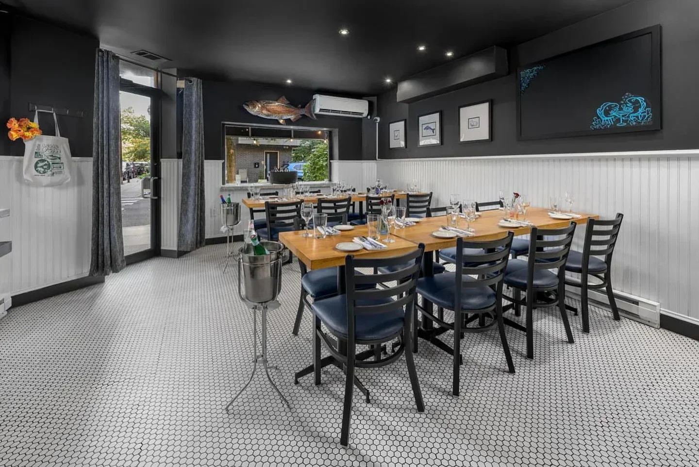 Interior dining space at Little Fish restaurant in Philadelphia, featuring stylish decor.