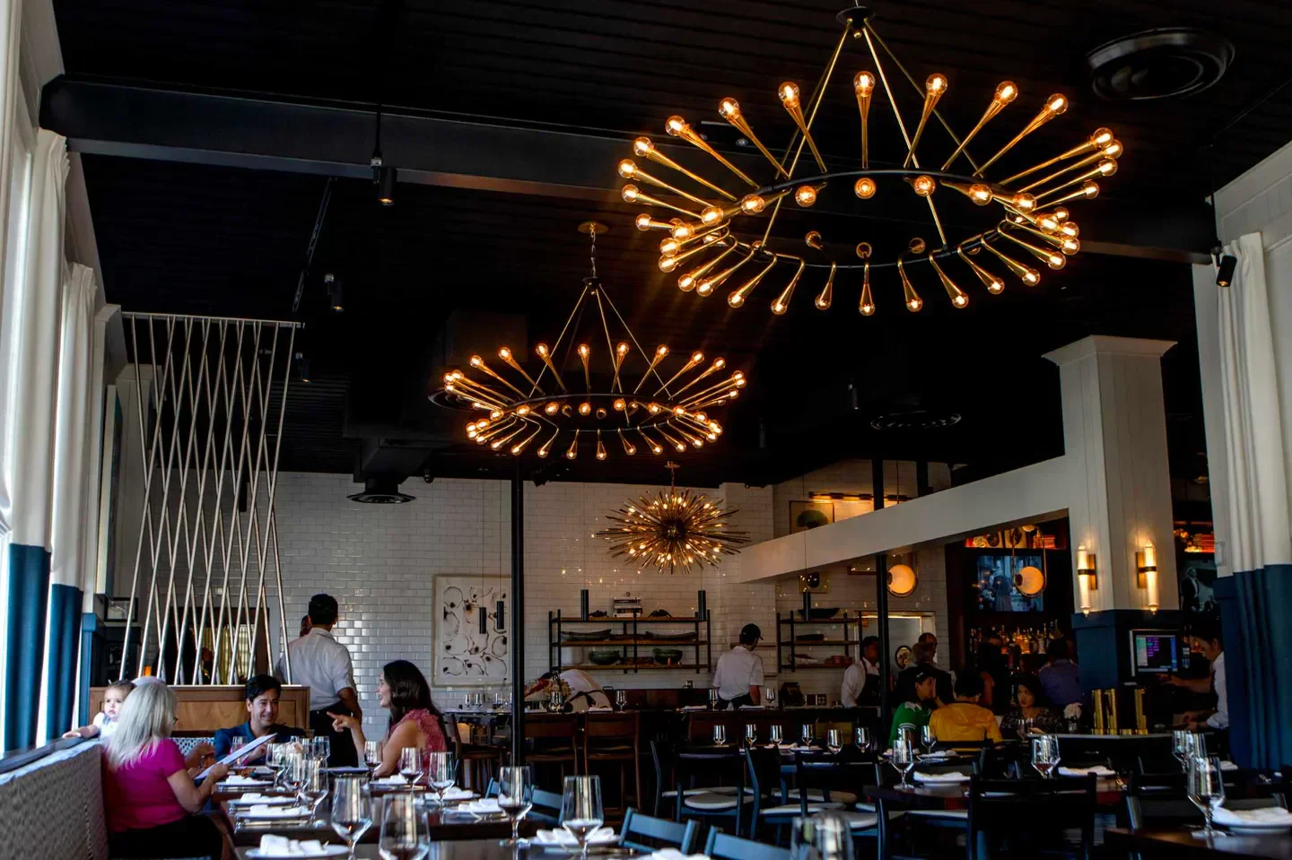 Interior of Little's Oyster Bar in Houston with unique light fixtures and dining area