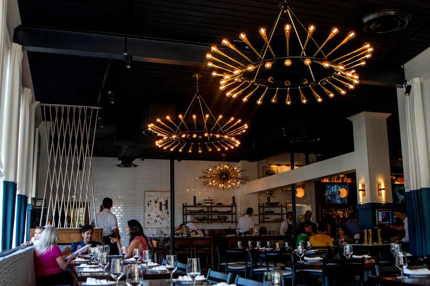 Interior of Little's Oyster Bar in Houston with unique light fixtures and dining area