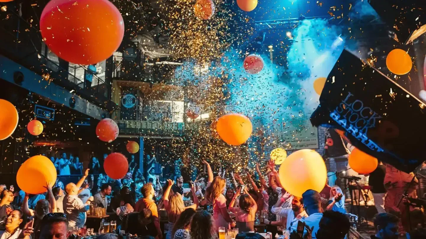 Party scene at Lock Stock & Barrel Abu Dhabi, with balloons and confetti in the air in Abu Dhabi.