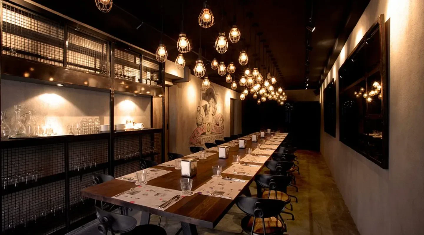 Stylish interior dining at Lolla restaurant in Singapore, featuring unique lighting and decor.