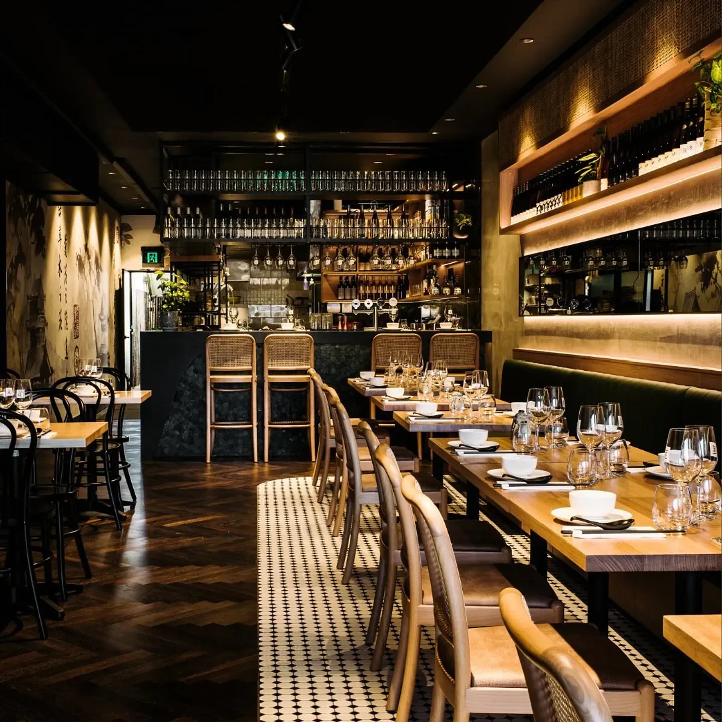 Interior of Lotus Dumpling Bar - Summer Hill, Sydney, with tables and bar setting.