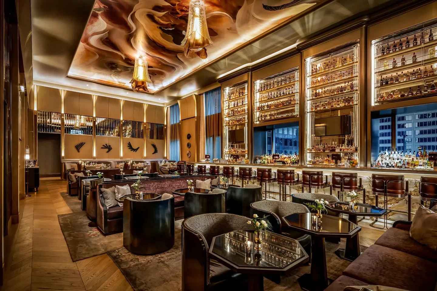 Interior of LOUIX LOUIS in Toronto with bar and seating area.
