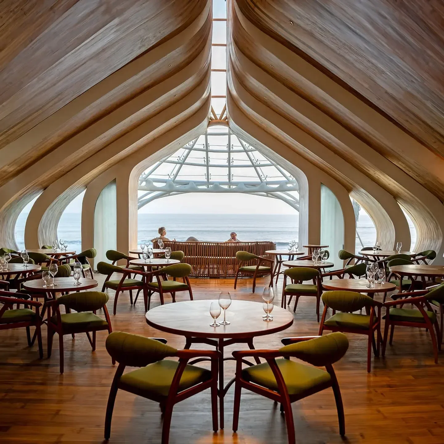 Interior of LUNA Beach Club in Bali with ocean views and stylish seating.