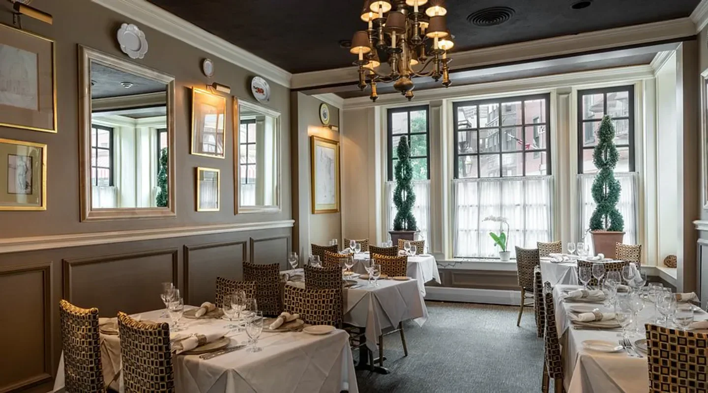 Elegant dining room interior at Mamma Maria restaurant in Boston with decorated tables