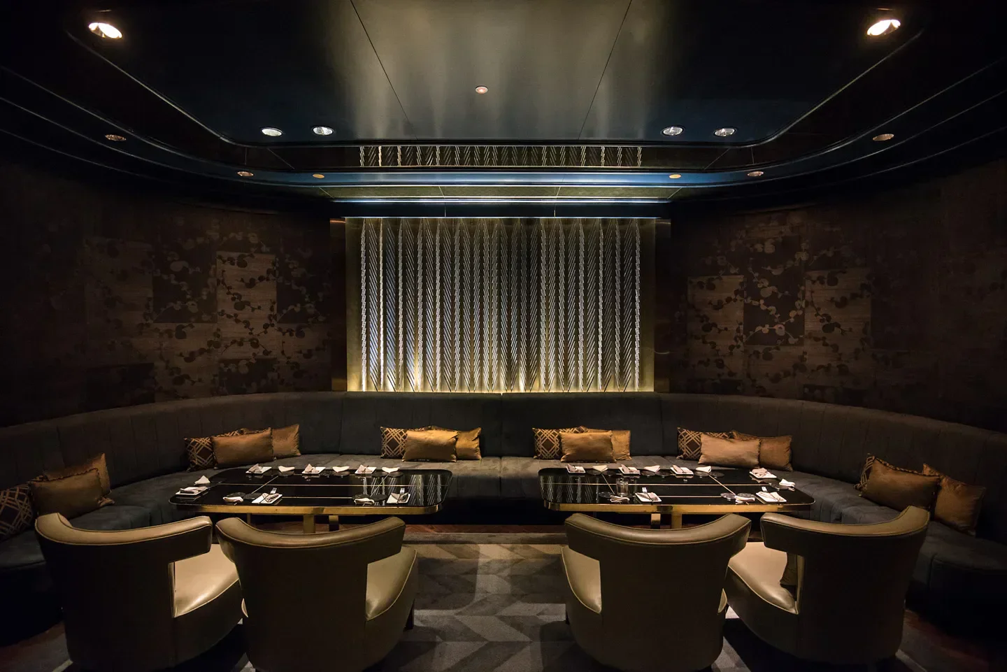 Manhattan Singapore restaurant's stylish interior with intimate seating and elegant design.