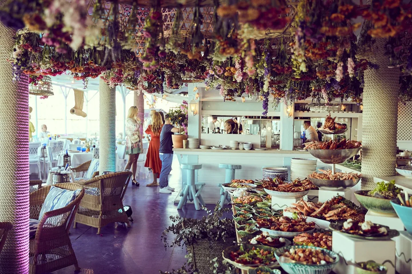 Abundant seafood buffet spread at Marbella Club Beach Club in Marbella, under a floral canopy.