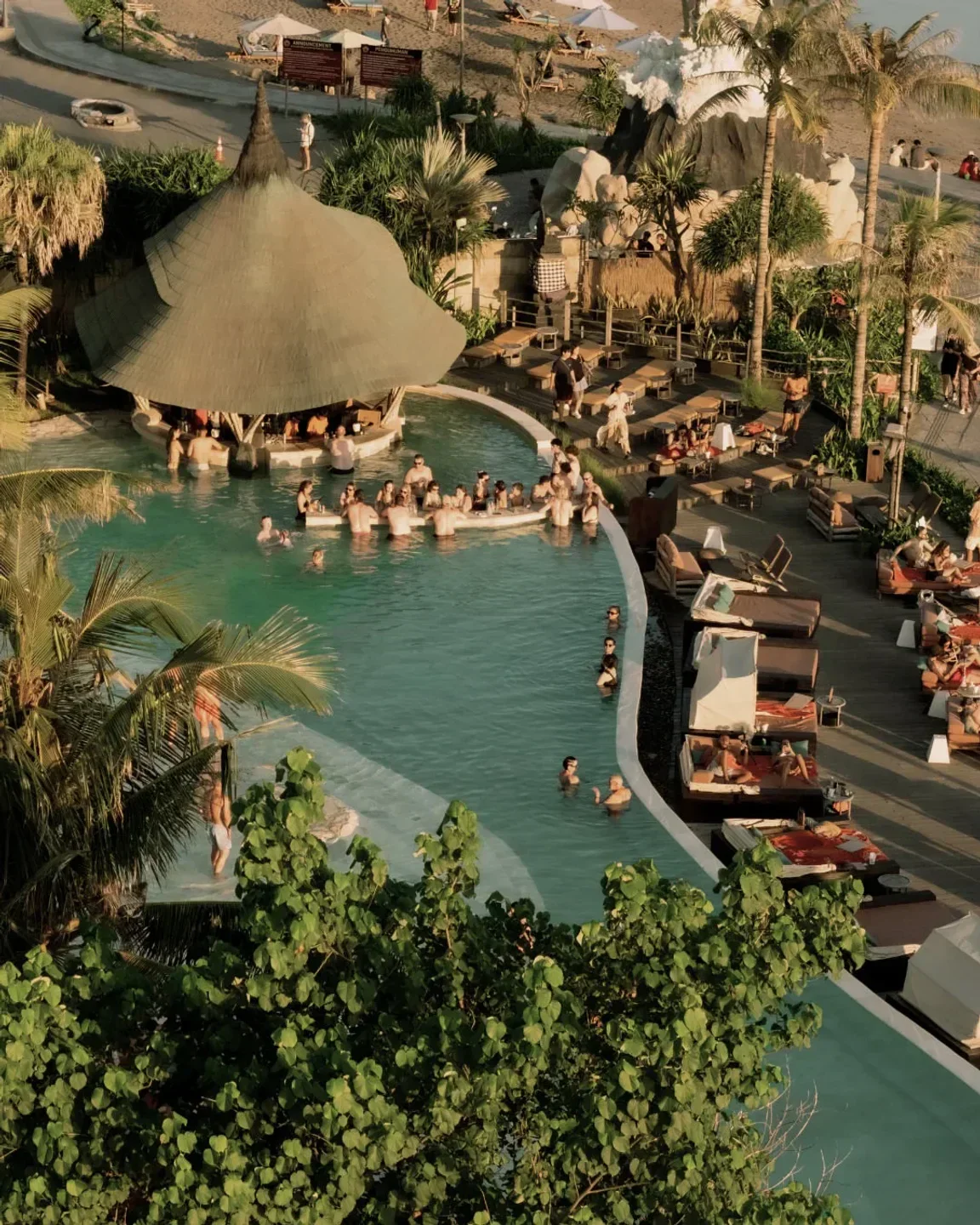 Aerial view of Mari Beach Club in Bali with pool, bar, and beach