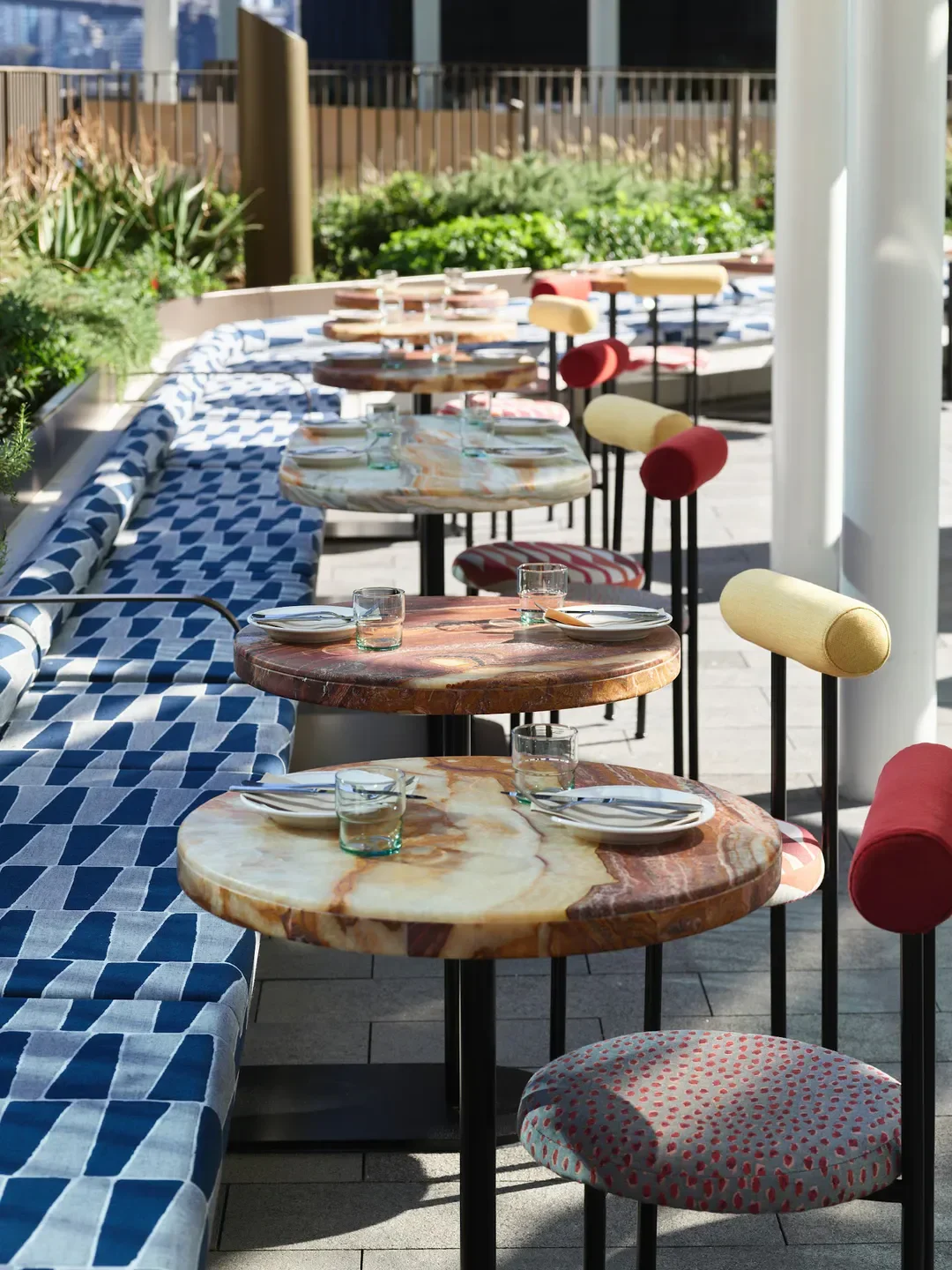 Outdoor seating at Martinez restaurant in Sydney, featuring stylish tables and chairs.