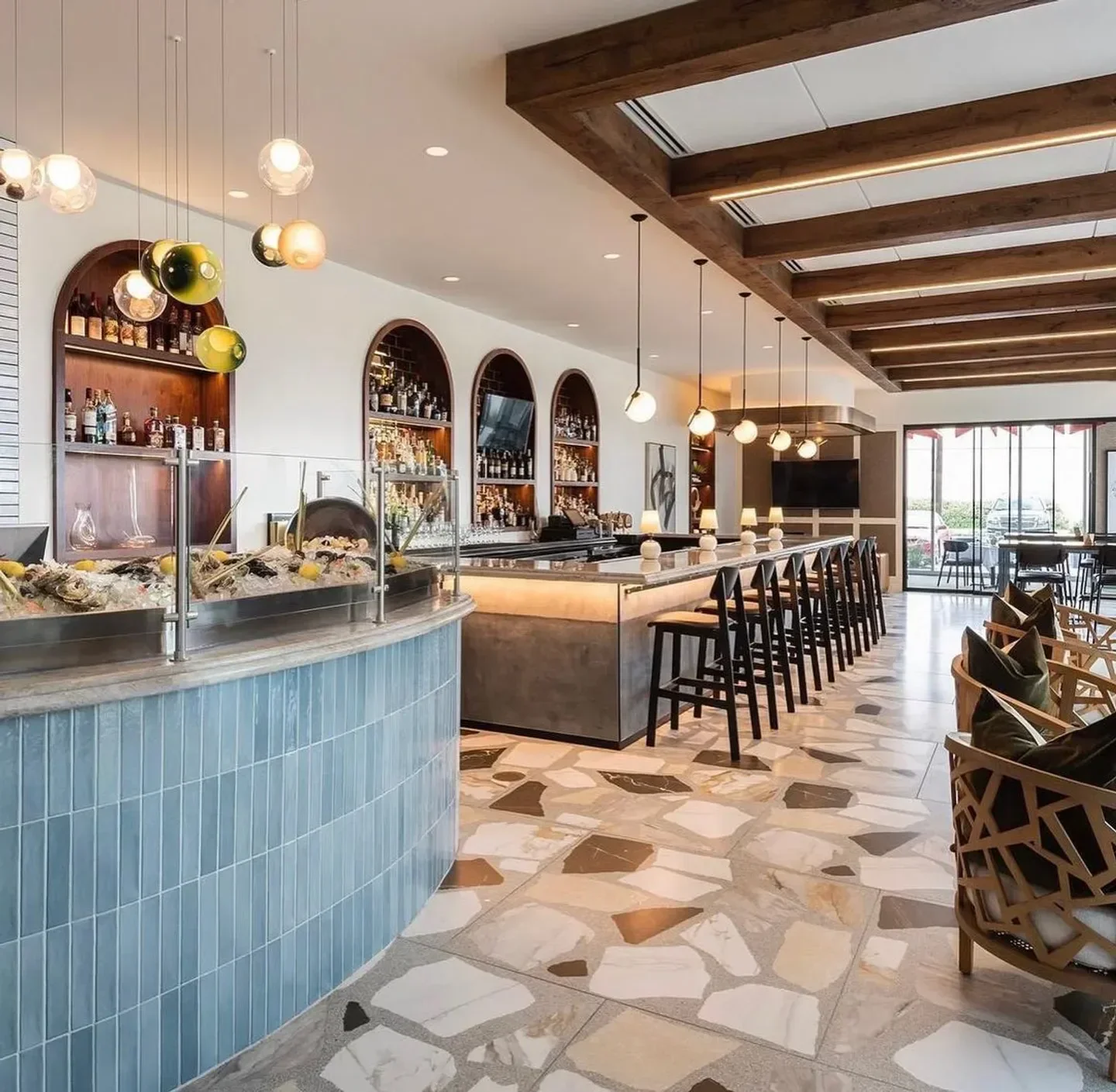 Masraff's restaurant interior in Houston, showcasing stylish bar and dining area.
