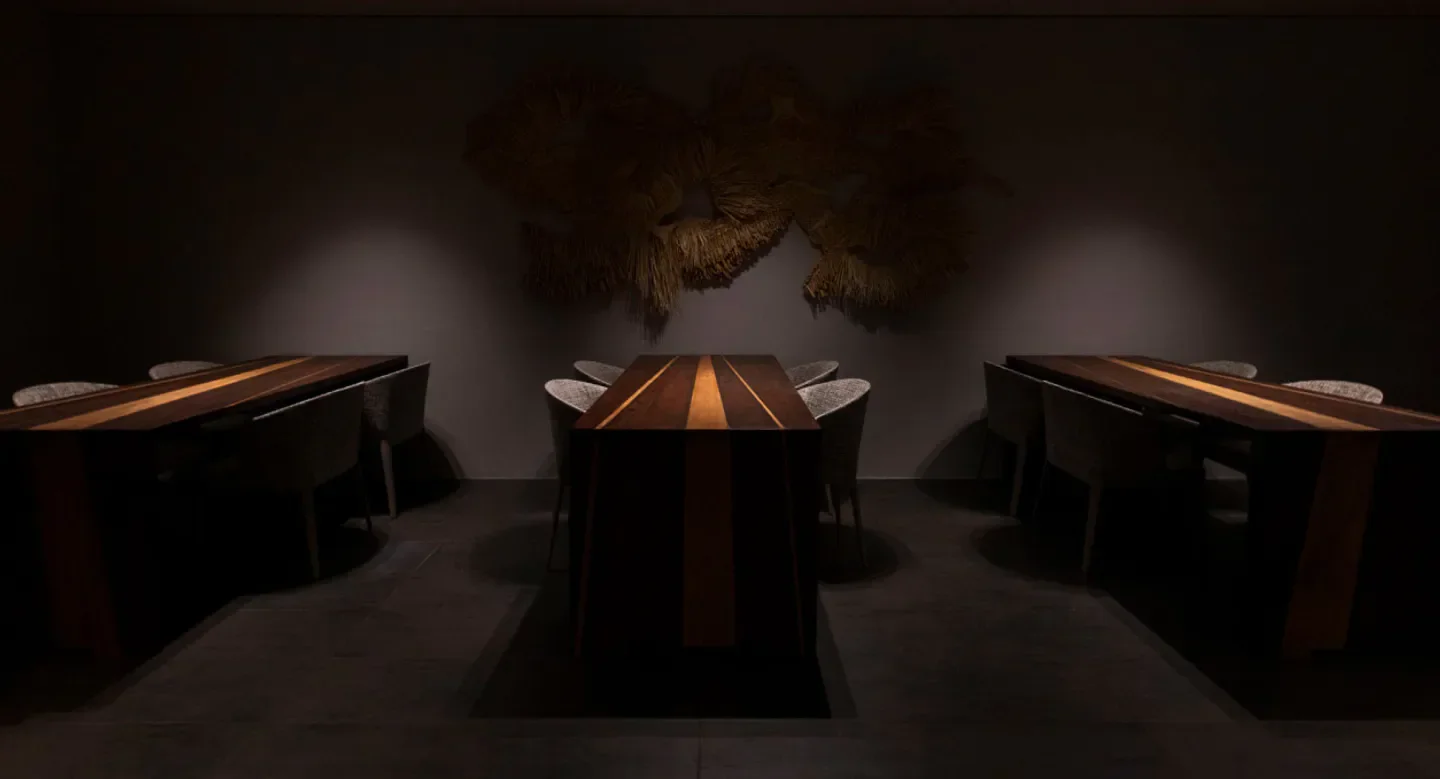 Dining space at MAZ restaurant in Tokyo with elegant wooden tables and chairs