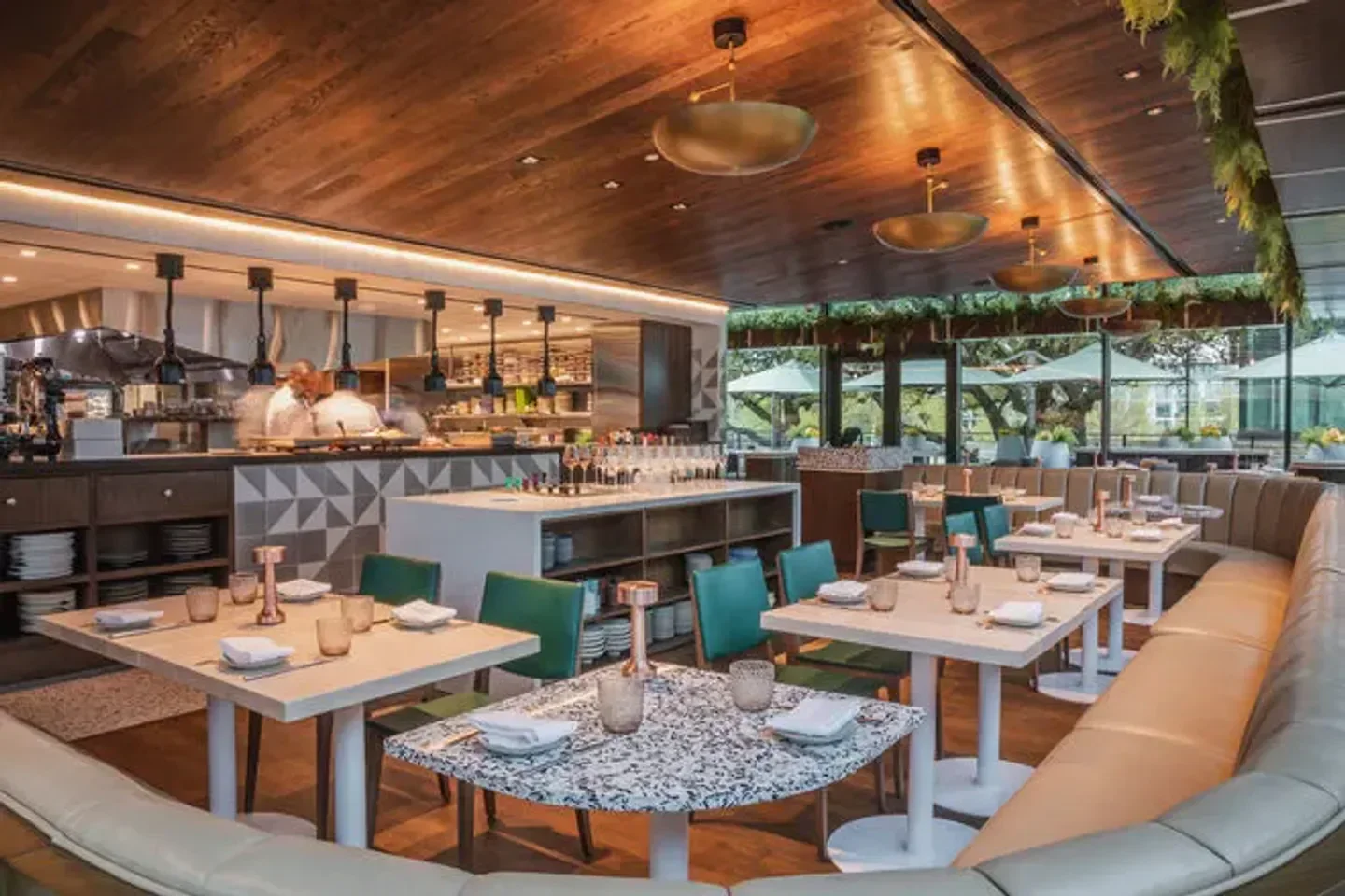 Interior of Meridian restaurant in Dallas, featuring stylish seating and open kitchen.