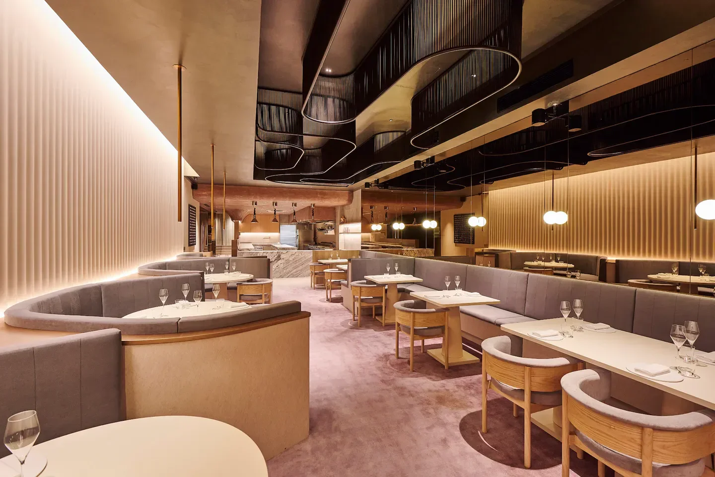 Interior of Meta restaurant in Singapore, featuring stylish seating and warm lighting.