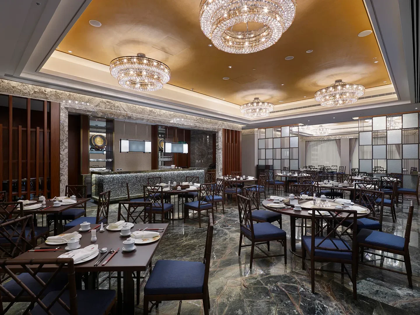 Elegant dining area at Mipon restaurant in Taipei, featuring chandeliers and tables