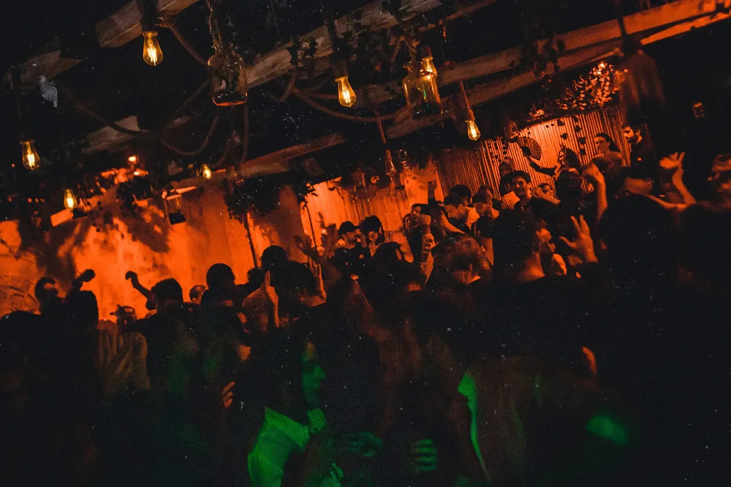 Energetic nightlife scene at Mirage nightclub in Paris, with dancing and stylish decor.