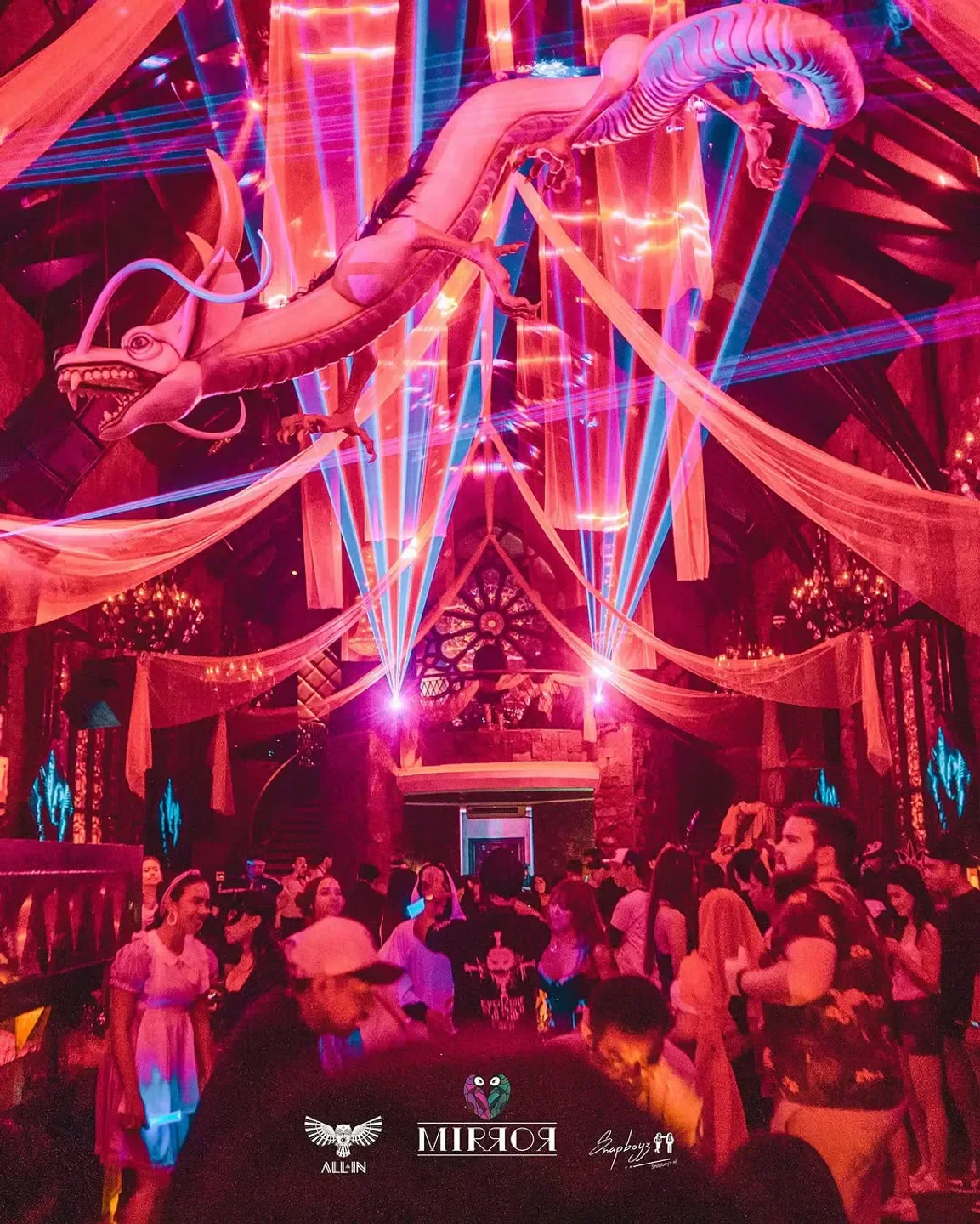 Dragon sculpture and lasers illuminate the dance floor at Mirror nightclub in Bali.