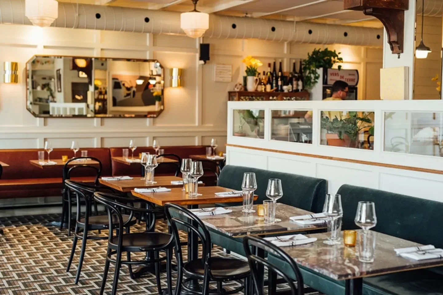 Cozy interior of Mon Lapin restaurant in Montreal with tables set and ready.