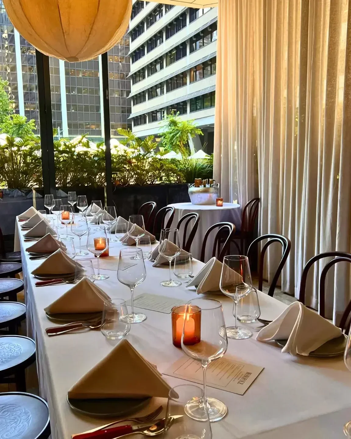 Elegant dining table set for dinner at Monopole restaurant in Sydney.