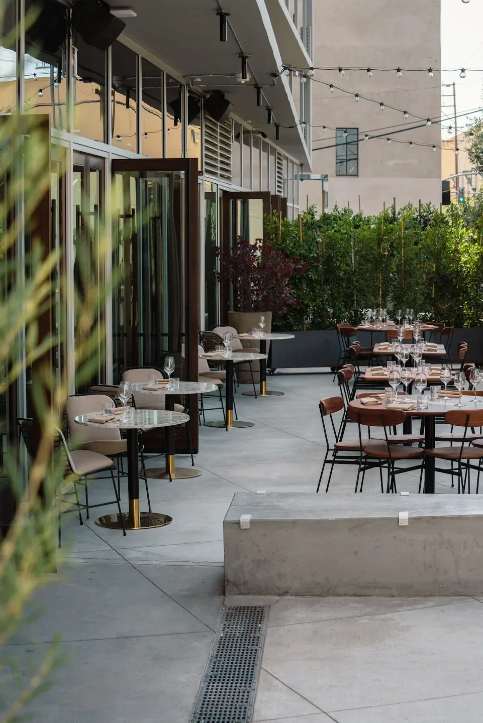 Outdoor dining area at Mr. T restaurant in Los Angeles with table settings.