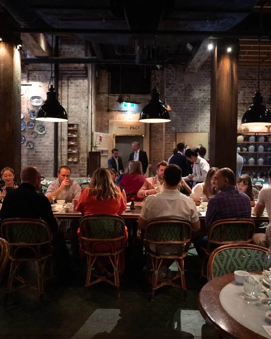 Dining experience at Mr. Wong restaurant in Sydney, featuring elegant interior and patrons.