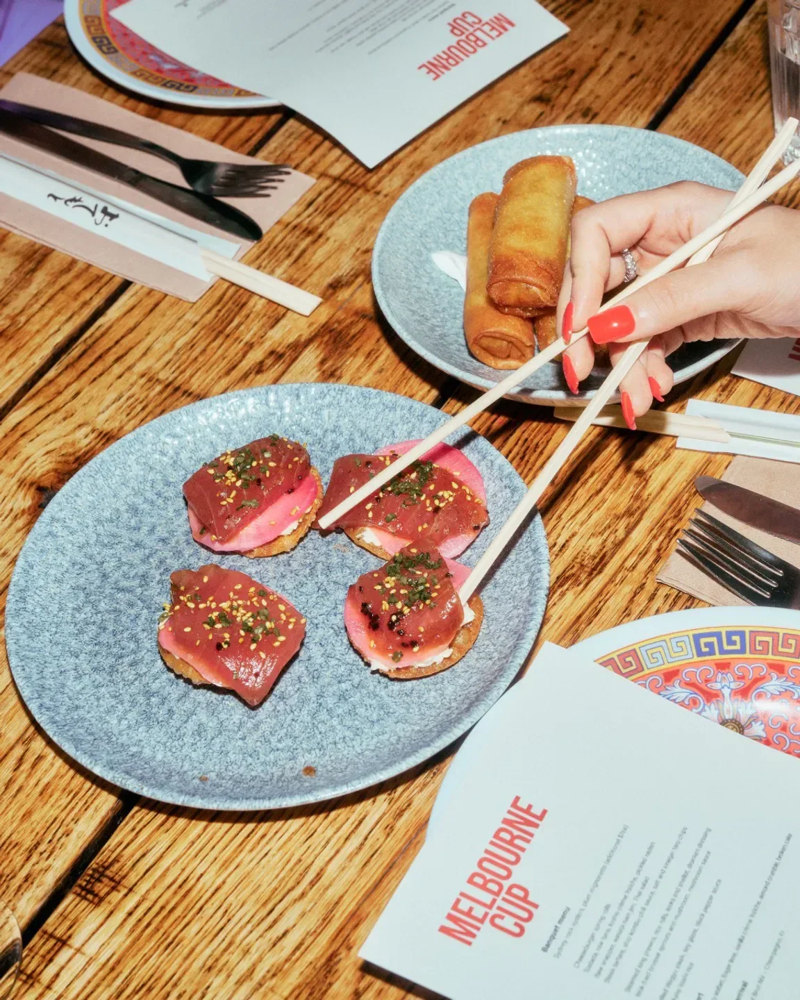 Delicious small plates at Ms. G's restaurant in Sydney, featuring tuna and spring rolls.