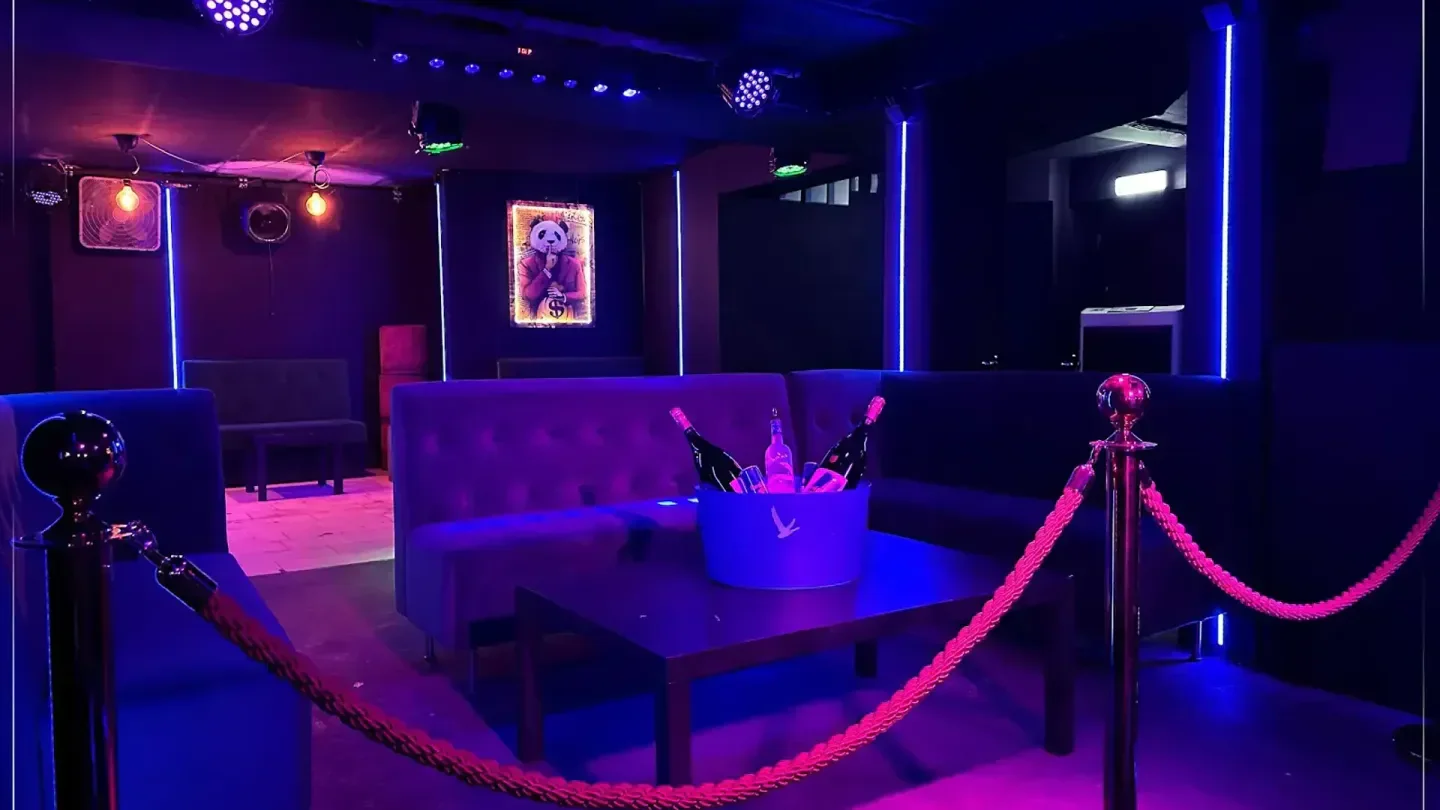 Interior of MYST nightclub in Stockholm, with neon lights and bottle service.