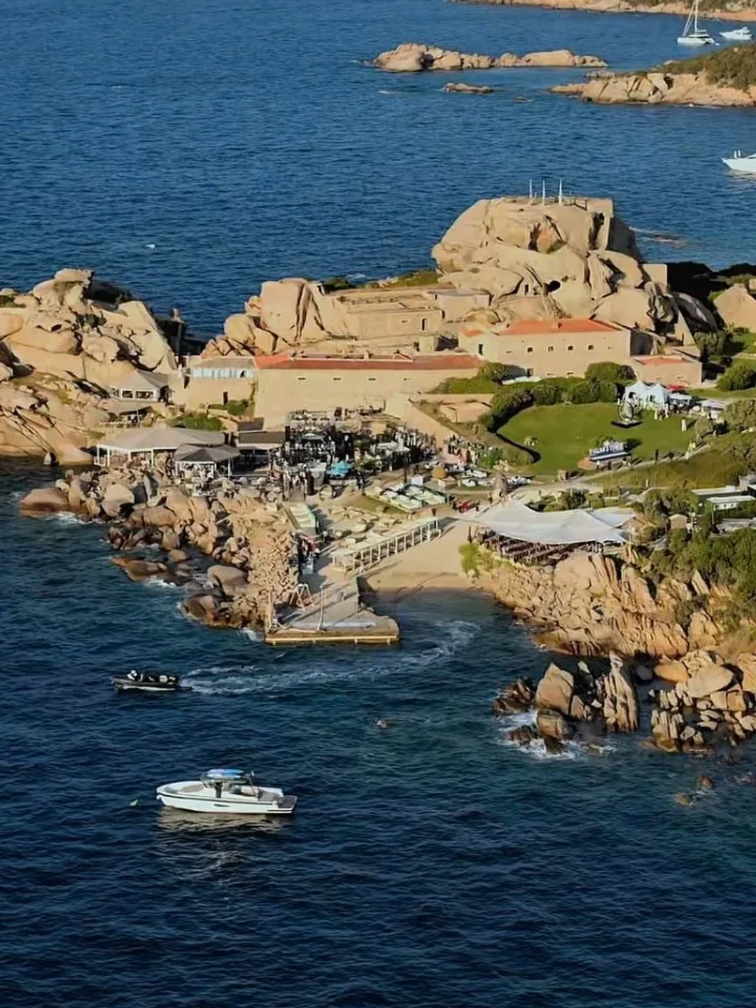 Aerial view of Nammos Beach club in Porto Cervo with rocky coastline and yachts