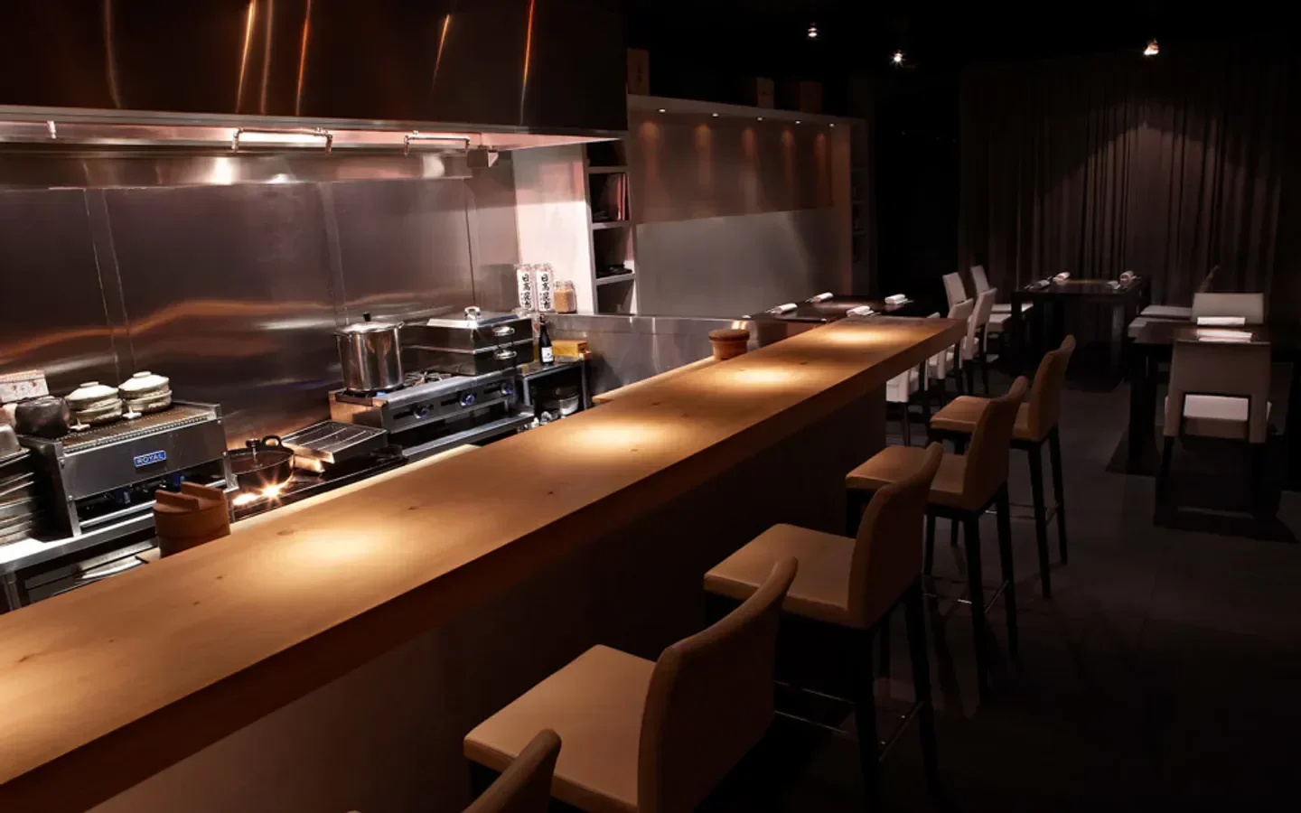 Interior view of Naoe Miami, featuring a sushi bar and restaurant seating area.