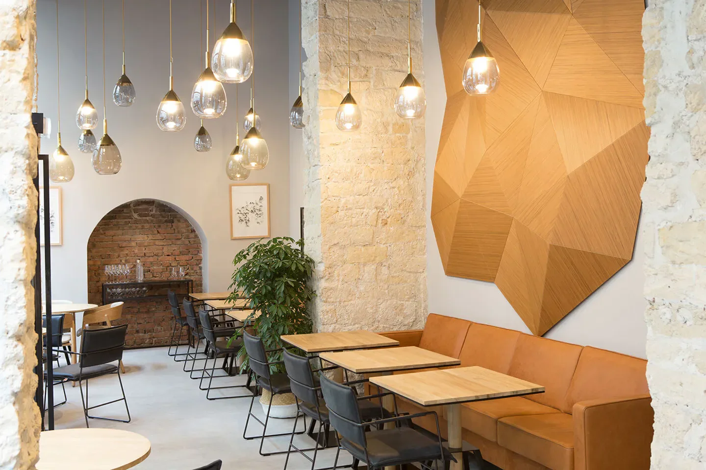 Interior of NESO restaurant in Paris, featuring stylish lighting and modern decor.