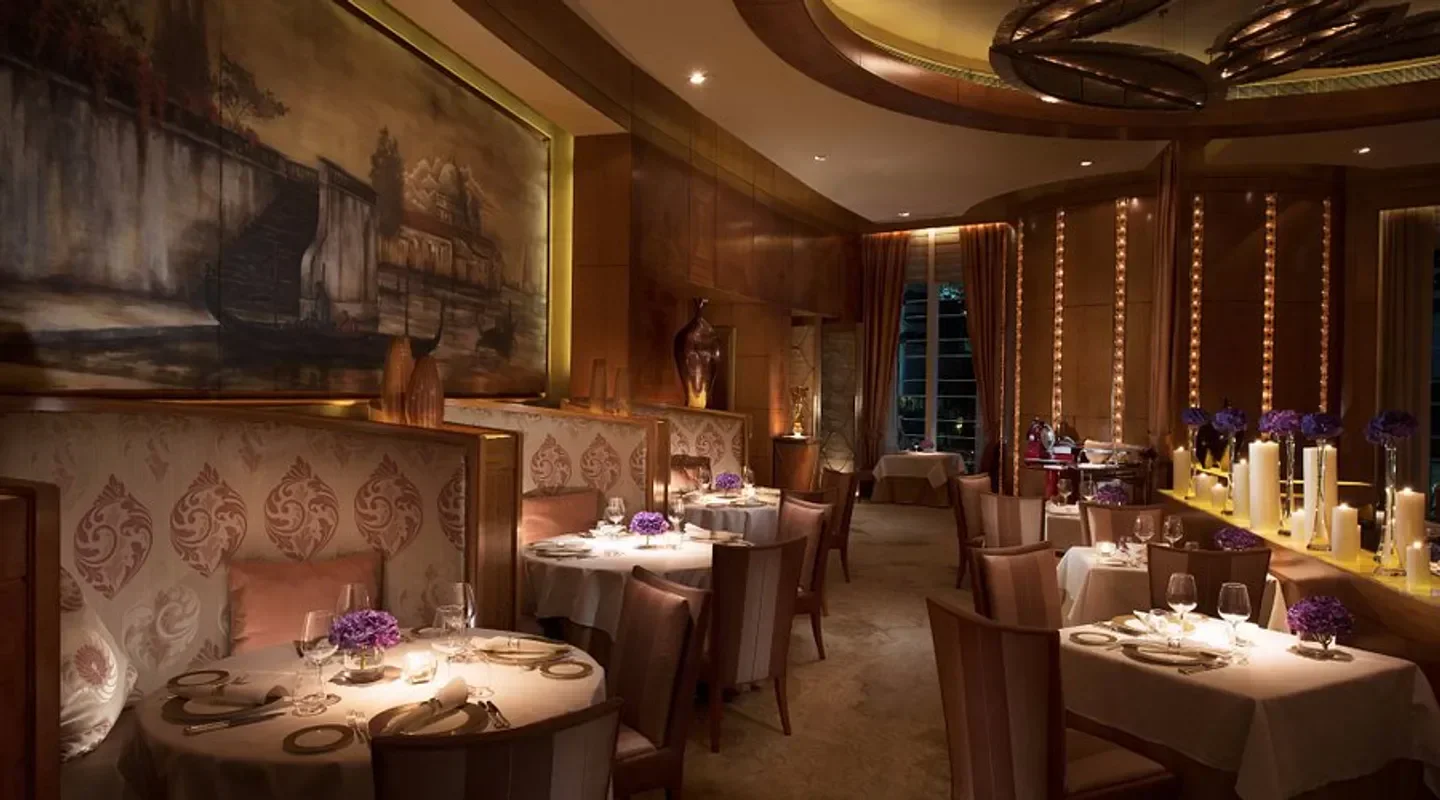 Elegant interior of Nicholini's restaurant in Hong Kong, featuring fine dining tables.