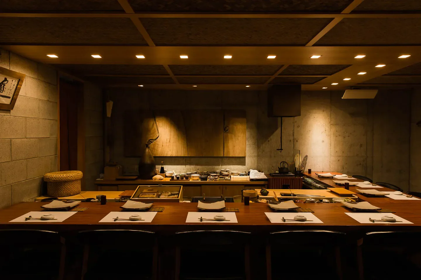 Interior of Nishiazabu Taku restaurant in Tokyo, featuring a long dining table setup.