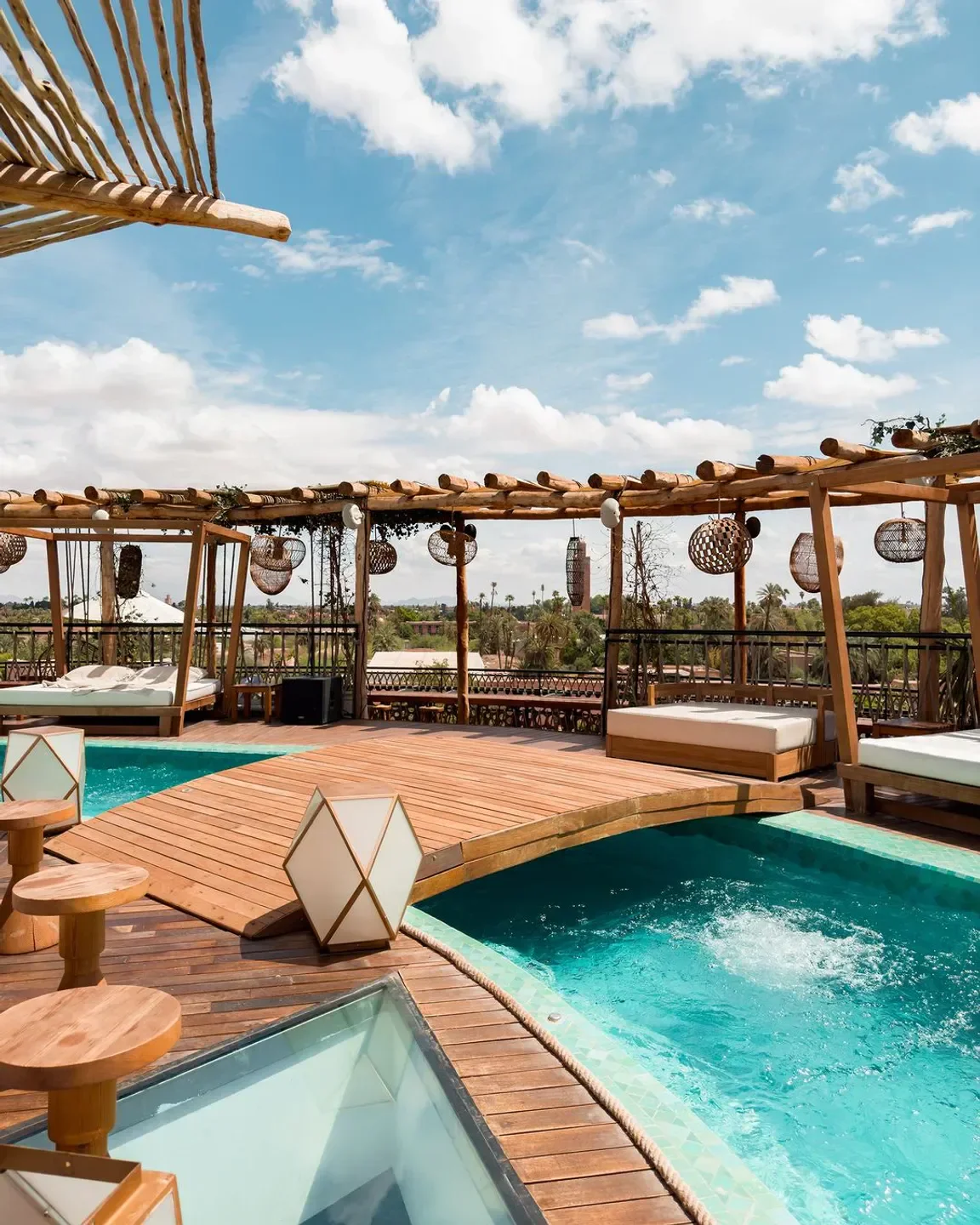 Nobu Marrakech restaurant's pool and wooden deck, with stylish decor and seating areas.